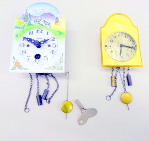 Two Miniature Dollhouse Clocks: One miniature German Heco porcelain face clock & one celluloid unmarked clock, nice for German toy kitchens, 4in. Tallest