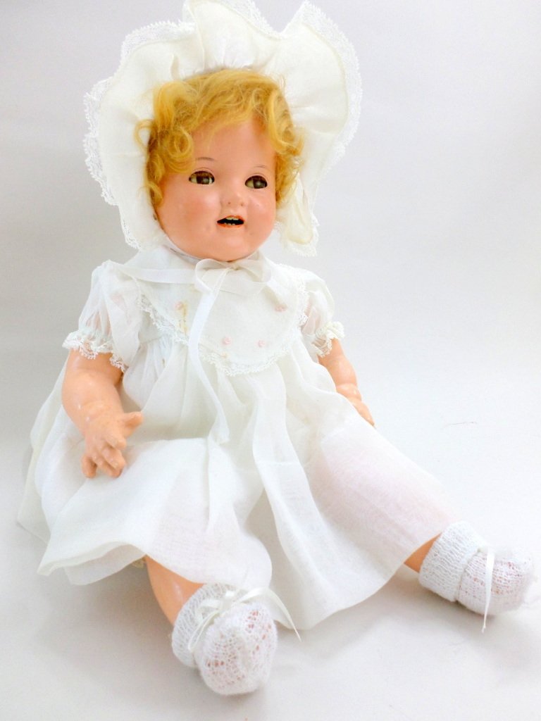 Flirty Eye Eighteen inch Shirley Temple Baby Doll: Ideal 18in. Flirty eye Shirley Temple baby, composition head on shoulder plate, compo arms & legs, cloth body, w/cryer, flirty sleep eyes, open mouth, dimpled cheeks, original wig, dressed in white or