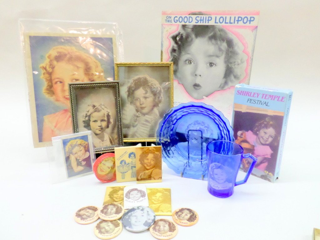 Lot of Shirley Temple Memorabilia: Consisting of two framed pictures of S.T. several small mirrors, Shirley Temple Festival VHS tape, several pcs. Of sheet music of her movie songs & S.T. bowl & cup