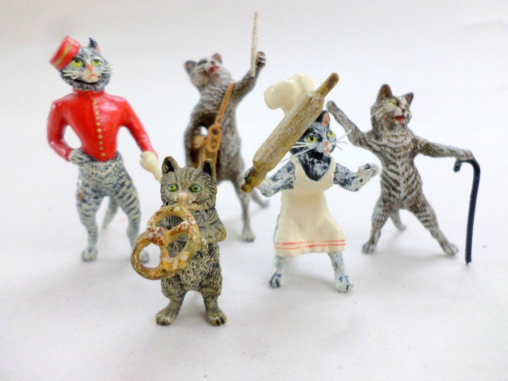 Group Vienna Bronze Cats: Nice grouping of 5 Vienna bronze cats, cat w/rolling pin marked F.B., cat selling newspapers, cat bell hop, cat w/cane & cat w/pretzel, all cold painted, tallest 2 1/4in.