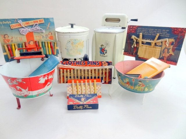 Child's Laundry Grouping: Grouping of vintage children's laundry items, clothes pin sets on cards, Wolverine and Chein wash tubs, two wasing machines, one electric (not tested), wringers, washboards, 12in. Tallest