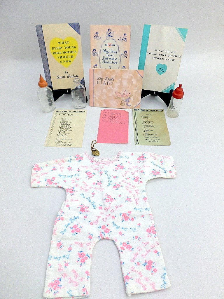 Effanbee Dy-Dee Bracelet, Bottles, Brochures: Great collection of Effanbee Dy-Dee baby brochures by Aunt Patsy, Dy-Dee's diary which was never used, Layette listing, 3 bottles, pajamas, & bracelet