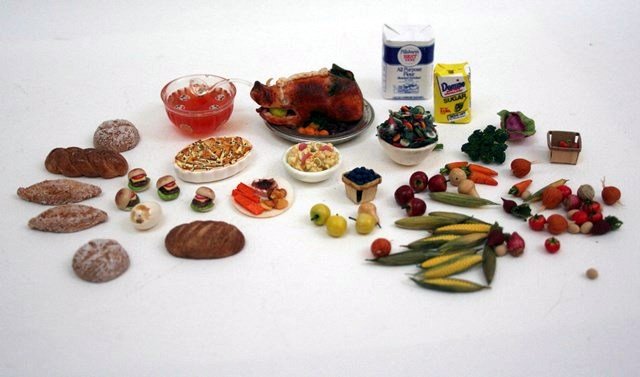 Artisan Foodstuffs: Great assortment of artisan prepared and raw foods including an imposing roasted boar's head on platter 1.75" L, casserole in a Stokesayware casserole dish, prepared salads, many very realistic loose 