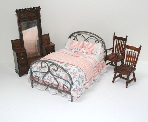 Lorraine Scuderi Upholstered Bed: A most inviting metal bed with very appealing upholstery glued in place by Lorraine Scuderi 4" H, 7" L, 5" W. Also a commercial mirrored chest and pair of chairs. MK