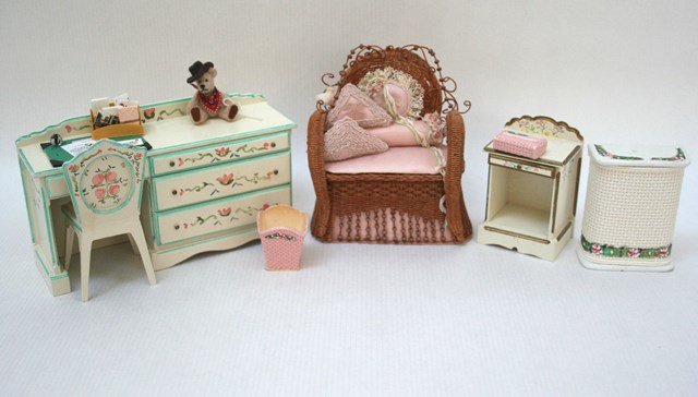 Charlotte Weston Furniture: A combination desk and drawer unit by Hal and Charlotte Weston 3" H, 5.5" L with matching chair, a nightstand by the same, a finely woven wicker chair with a lavish array of pillows, a laundry hamper,