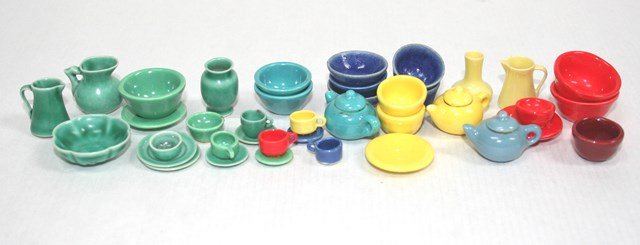 Colorful Dinnerware: Brightly colored plates, bowls, tea pots, etc. in mid-20th century colors including a textured bowl signed KD 1" diameter. Over 40 pieces. MK
