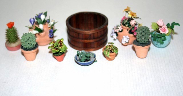Potted Plants: Flower pots filled with flowering plants and cactii, as well as a cider tub by Oldham Studios 1" H, 1.75" W. Eleven items. MK