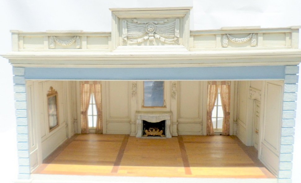Louis XV Roombox: A spacious salon with stucco exterior featuring textured quoining and a majestic cornice with molded ornamentation. The interior features parquet flooring, paneled walls, faux marble fireplace with mi