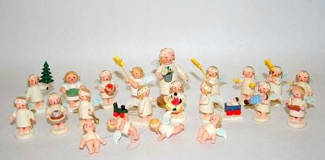 Wendt & Kuhn Angels: Twenty-one hand-painted collectible angels with blue and white wings, tallest 2.5" H, engaged in various celestial activities. Two are strung as ornaments.