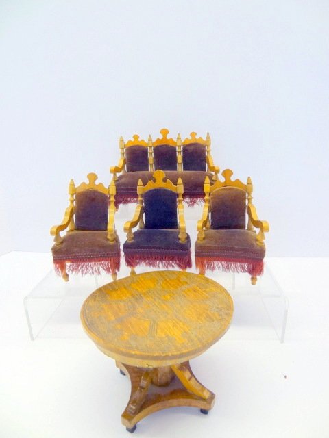 German Oak Dollhouse Furniture: German oak settee and three chairs with round pedestal table. Tallest 4 1/4in