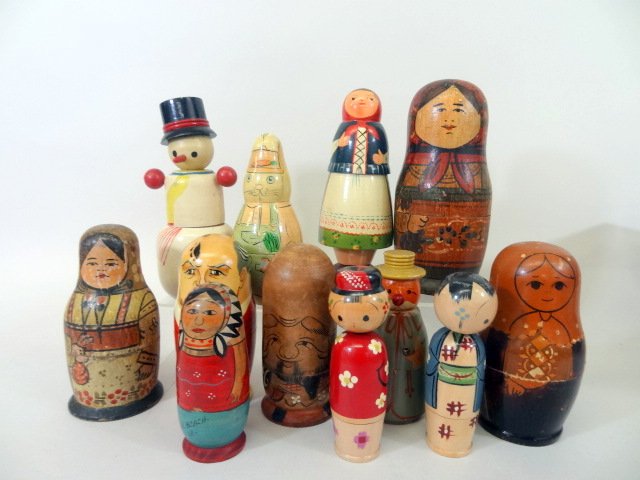 Collection of Nesting Dolls: Eleven Nesting Dolls, all styles and color, some Russian, Oriental, Snowmen, etc. One is contemporary others have age. 9" tallest