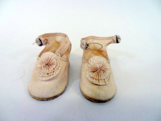 Jumeau Style Doll Shoes: Beautiful Cream colored Jumeau Style doll shoes, with pleated pompons on top, has logo on bottom. 3" length