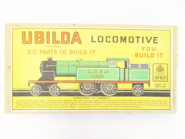 Ubilda Locomotive in OB: Vintage Ubilda locomotive kit in original box. Unbuilt tin locomotive wind-up kit made in England.