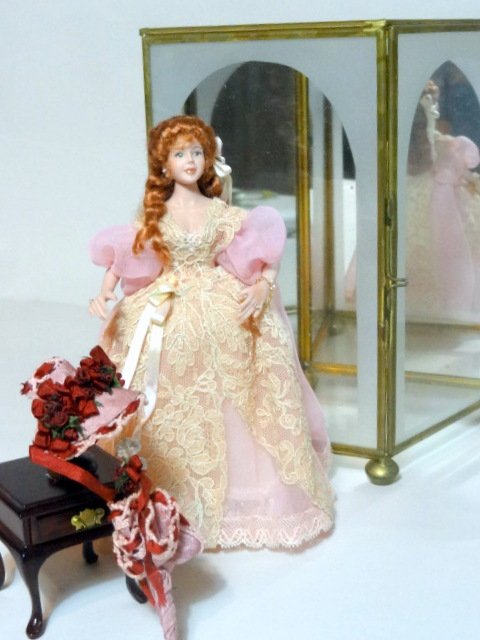 Rosemary Tucker Pink Elegant Lady with Case: Rosemary Tucker 6 in. pink elegant lady w/hat of delicate satin roses & parasol case & stand are included 7 in. x 6 1/2 in. x 4 in.