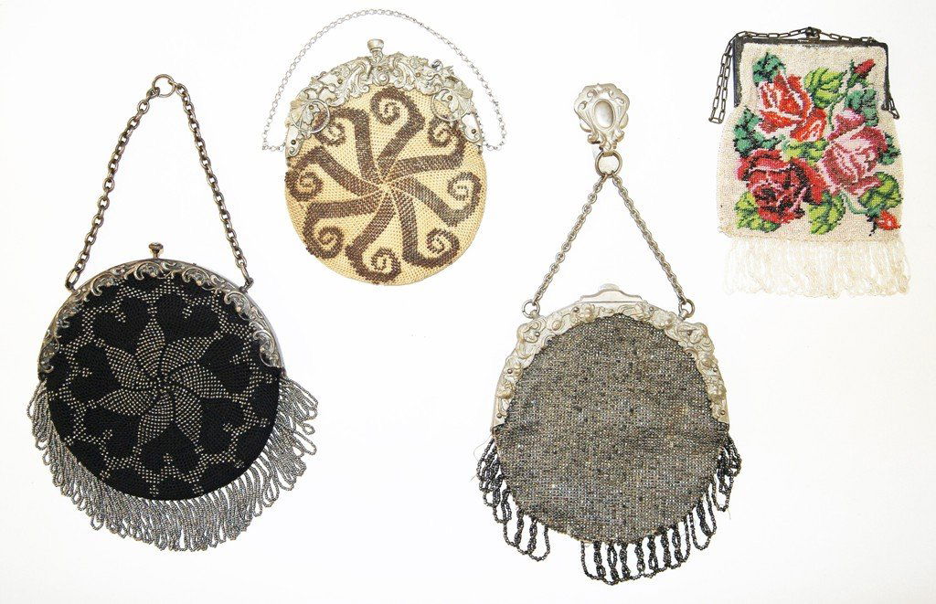 Four Vintage Beaded Purses: Four vintage beaded purses, 1 - round vintage purse, metal beads on black woven background, rococo steel frame with push button closure, 5.5" x 11" with chain and fringe, 2 - round purse with metal be