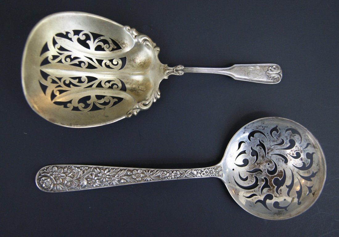 S. Kirk Repousse Strainer & Other: S. Kirk & Son repousse pattern strainer with round bowl 9" L, fiddle shell pattern strainer with oval bowl 8" L with monogram, 5.32 OZT total weight