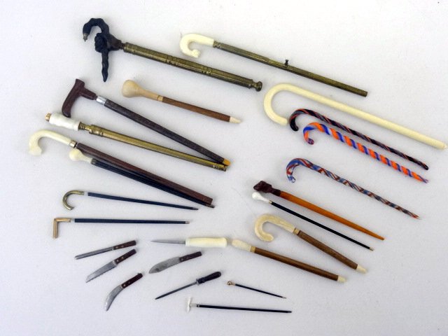 Joseph Gray Collection Larkin Sword Miniature Canes: From the Joseph Gray collection G orge Larkin of nicely detailed brass and wooden canes, several Sword Canes with Bone handles, longest 3.5" L. also some fine kitchen knives by Frank Matter.