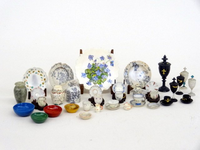 Frank Matter Cups and Plates: Very finely scaled cup and saucer sets with some stands, decorated plates on stands, and some finely turned bone and ebony goblets and such. Largest plate 1.25" diameter. Made from unfired clay and/or