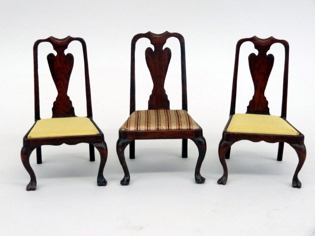 Richard Mann Queen Anne Chairs: A pair of mahogany Queen Anne chairs with trifid feet and yellow satin upholstered seats 4 and 7/8" H, with a similar chair upholstered in a handsome stripe (one front leg repaired).