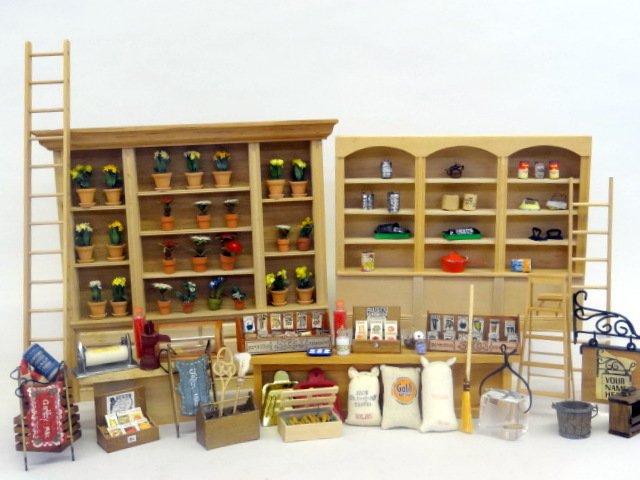 Dollhouse Garden Store: Everything you need for your Dollhouse garden displayed on racks, filled with flowers, seeds, ladders, all garden needs!