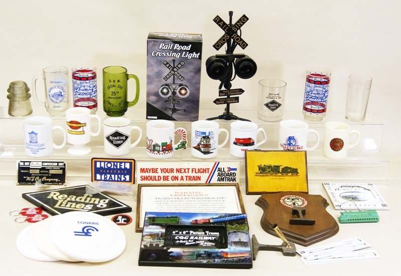Large Group Railroad Collectibles: Railroad crossing light in O/B, mugs, drinking glasses, patches, key chains, plaques, fans, watch, paper weights, plaques, coasters, etc.