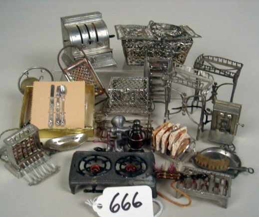 Pewter Lot: Basket, Cash Register, Toaster, Toast: Pewter Lot: Basket, Cash Register, Toaster, Toast Racks, Graters, Two Burner Stoves, Silverware, etc. 1 /2" to 2 1/2", 50pcs.