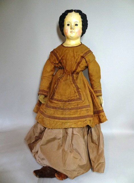 Original M.S. Superior Doll: Papier Mache 36" M.S. Superior head on cloth body with leather arms. Painted features, dark eyes, center part painted hair, original clothes