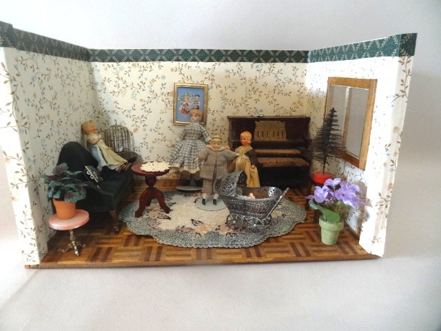 Vintage Music Room: A more recent roombox with parquet floor and assorted furnishings including an antique upright piano 5.25" W and four bisque children - tallest 5" H. also Schweizer soft metal baby carriage. 9" H, 14"