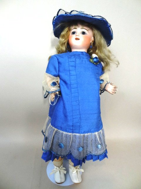 Kicking Steiner Doll: Jules Steiner, 18" Gigotuer - "Kicking Steiner" - France. Key wound mechanism crying, kicking child, glass eyes, o/m with two rows of teeth, pierced ears, papier mache torso, original mohair wig. Work