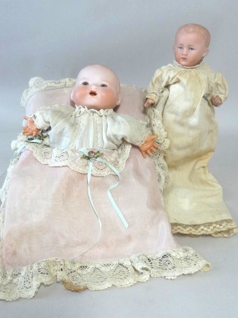 Pillow Baby Puppet and Germany Baby: AM Dream Baby in puppet pillow, blue sleep eyes, o/m, celluloid hand, back of pillow has opening to use baby as puppet; 7” bisque head baby on 5pc baby body, intaglio eyes, o/m, molded hair, incised