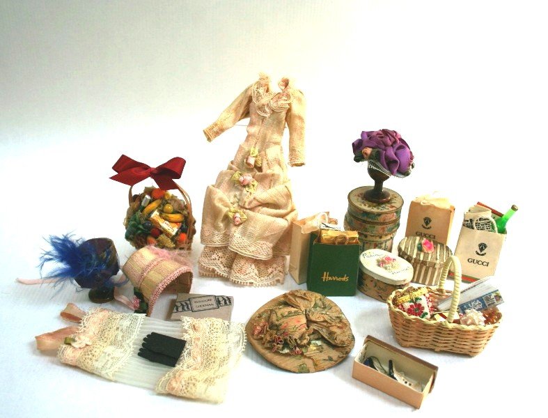 Dollhouse Miniature Lady's Millinery: Assortment of artisan hats and hatboxes, a frilly Victorian dress, negligee and other feminine treats. Gift basket 2.5" H.
