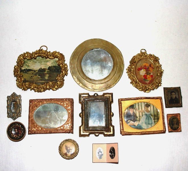 Antique Mirrors and Framed Pictures: An assortment of antique mirrors, pictures in antique ormolu frames, daguerreotype frames and smaller framed photos, Round mirror 3.25" diameter.