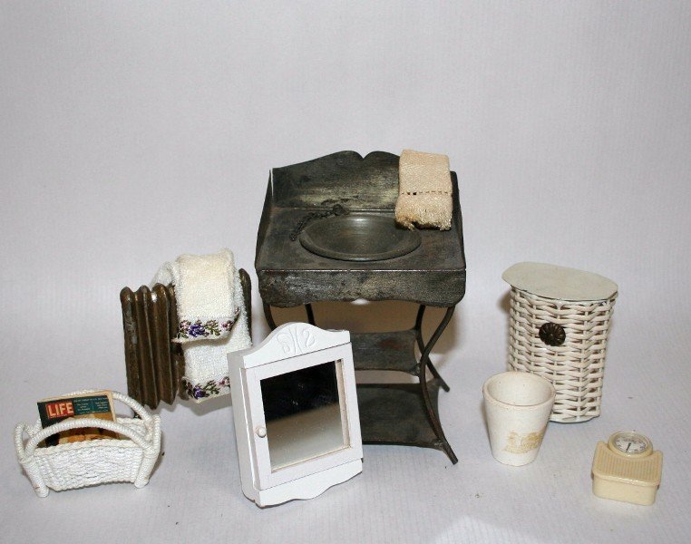 Antique Tin Washstand: A German tin washstand with basin plug on chain 4 and 3/8" H, 3" W, a gilt metal radiator (some paint loss) and some vintage bathroom accessories.