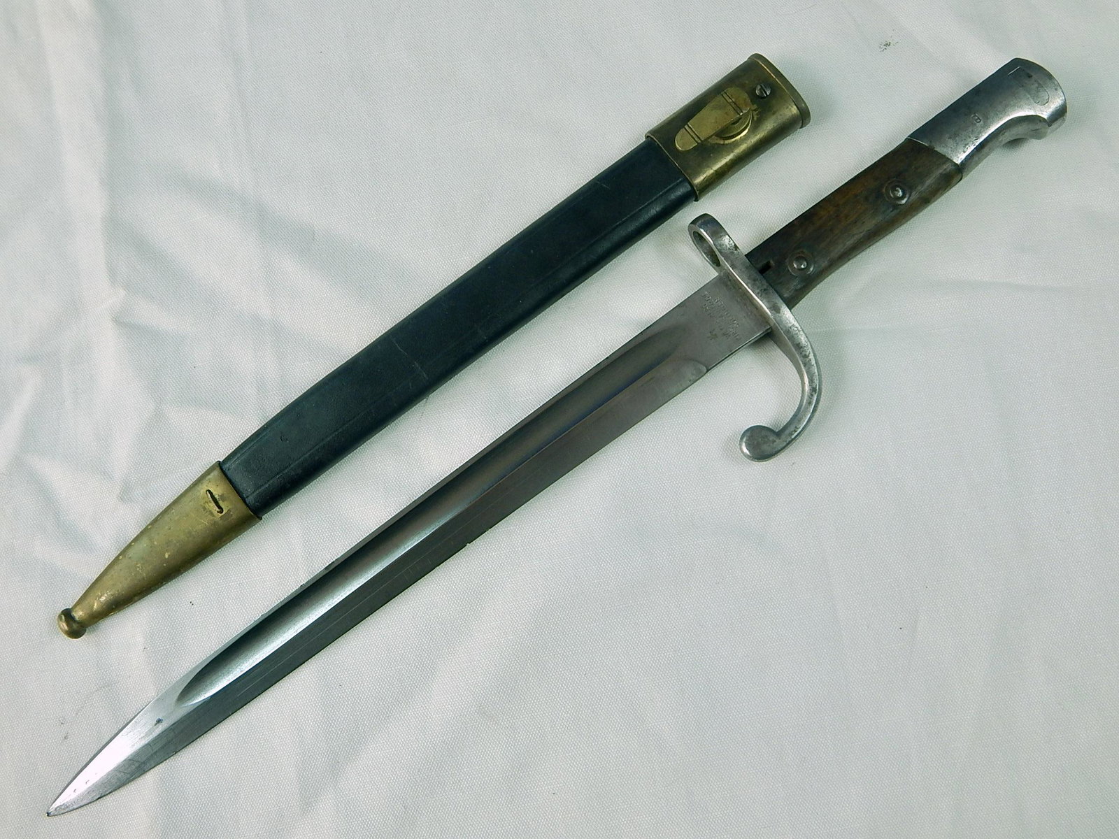 Argentina WW1 Model 1908 German Made Mauser Bayonet: Original Argentinian WW1 Model 1908 German Made Mauser Bayonet with Scabbard. Push button works. 16 7/8" long with 11 5/8" blade.