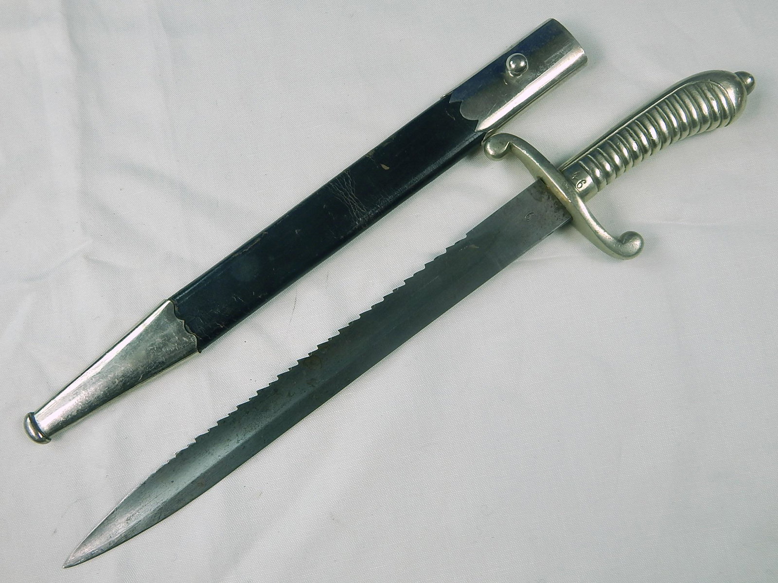 German Germany WW1 Police Saw Back Bayonet Dagger Sword: Original German WW1 Police Saw Back Bayonet with Scabbard. Solid. 17 1/4" total length. Blade is 12 1/2".