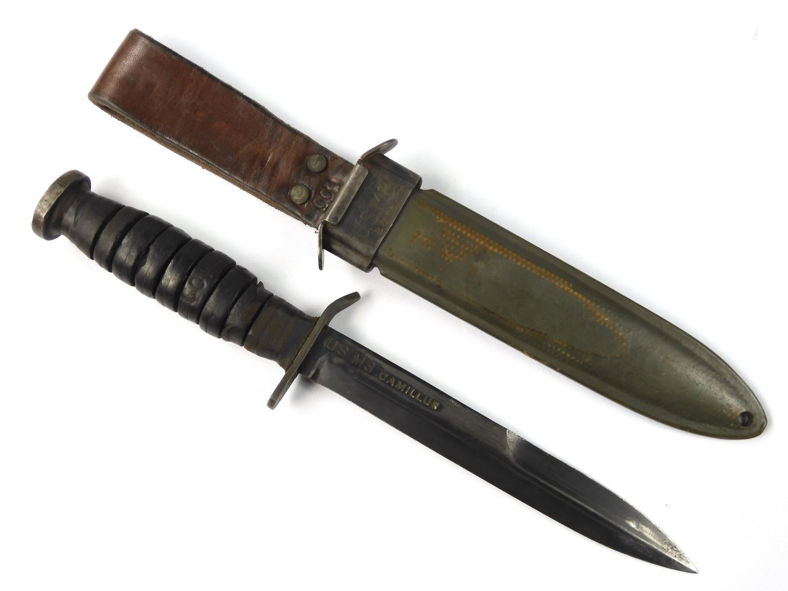 US WW2 Camillus M3 Trench Combat Fighting Knife: US WW2 Camillus M3 Trench Fighting Knife with Scabbard. 11 1/2"long with 6 3/4" blade. Guard and handle rings have a bit of movement. Pommel is ordnance stamped. The scabbard is a modified USM8, leath