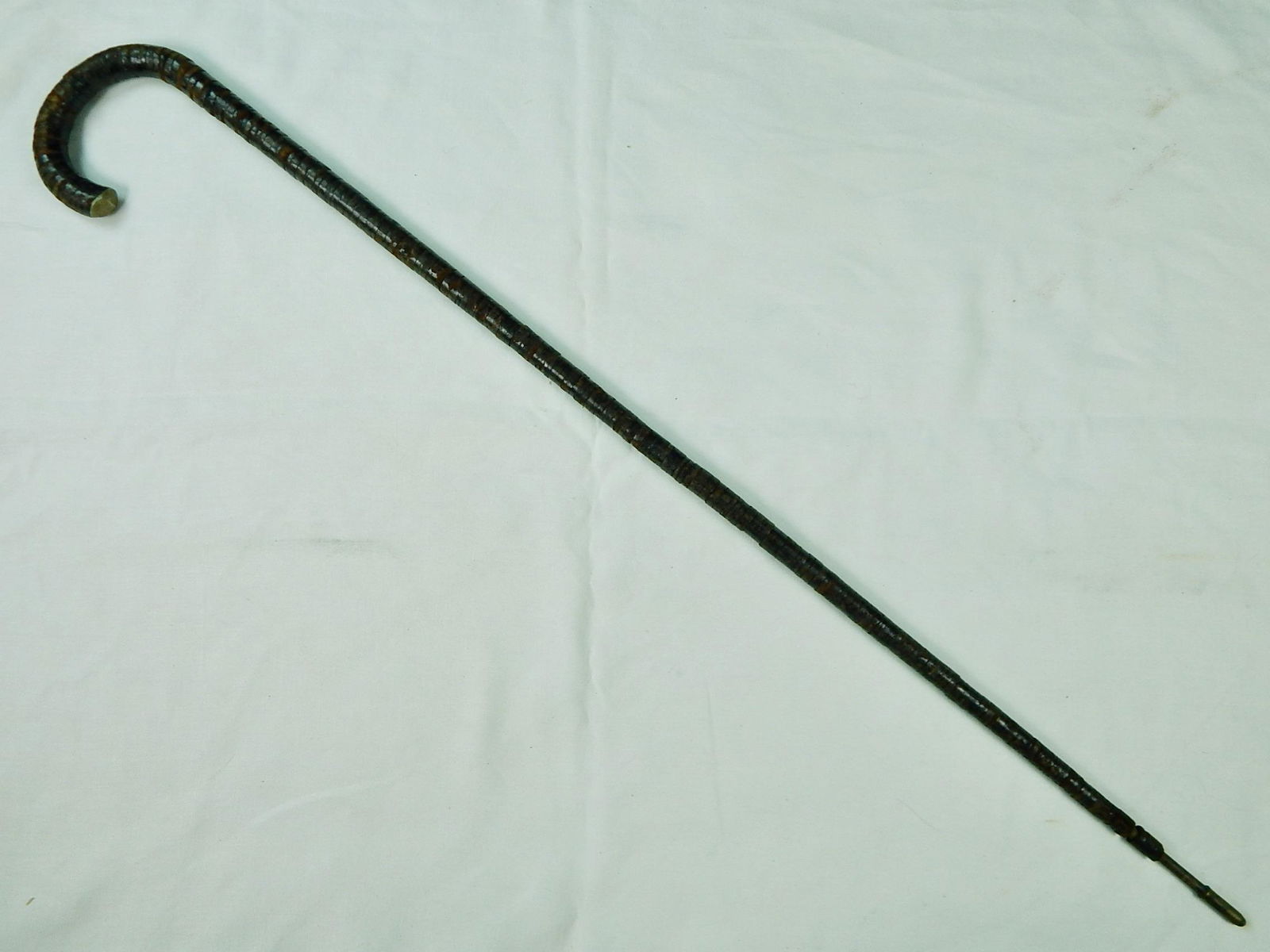 Vintage Antique Old US Walking Stick Cane: Vintage / Antique US Walking Stick. Made of leather rings, several rings are missing. 34 1/2" long.