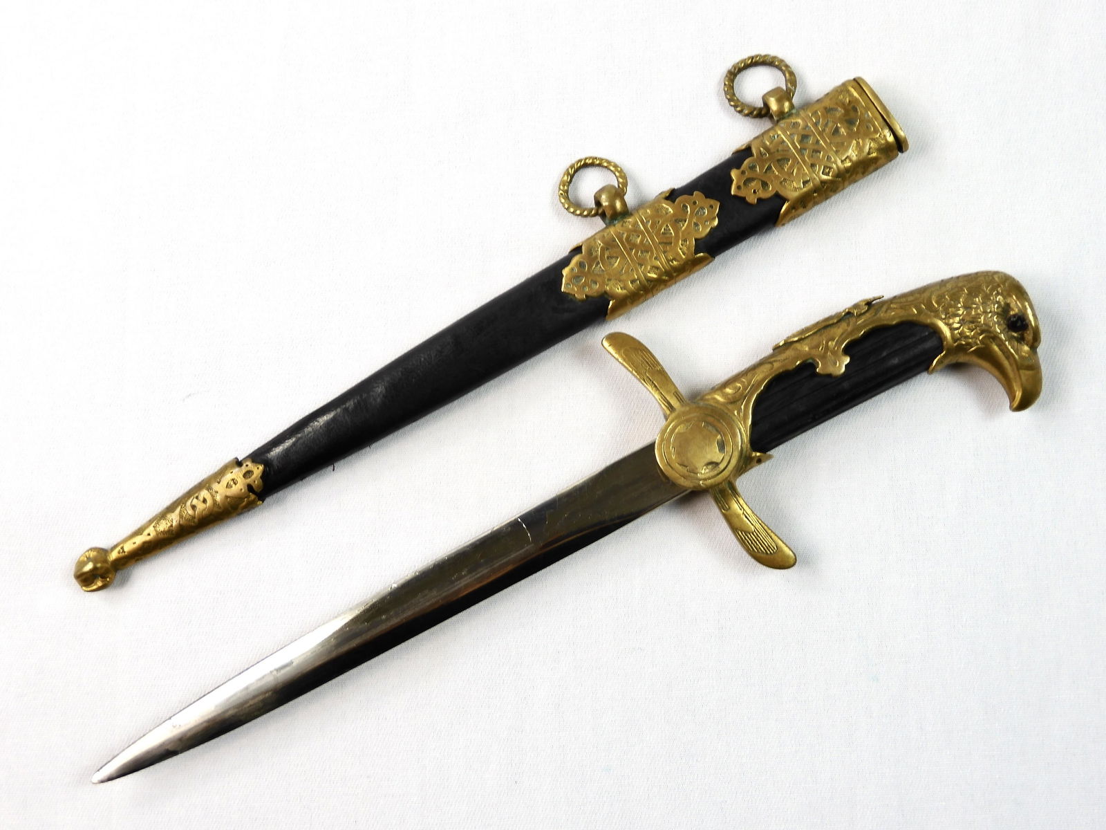 RARE Bulgarian WW2 Royal Air Force Dress Dagger Knife: VERY RARE Bulgarian WW2 (1930-45) Royal Air Force Eagle Head Dress Dagger with Original Scabbard. 9 3/4" long with 6 1/4' blade. Cast brass fittings. Black painted wood handle with small cracks. The b