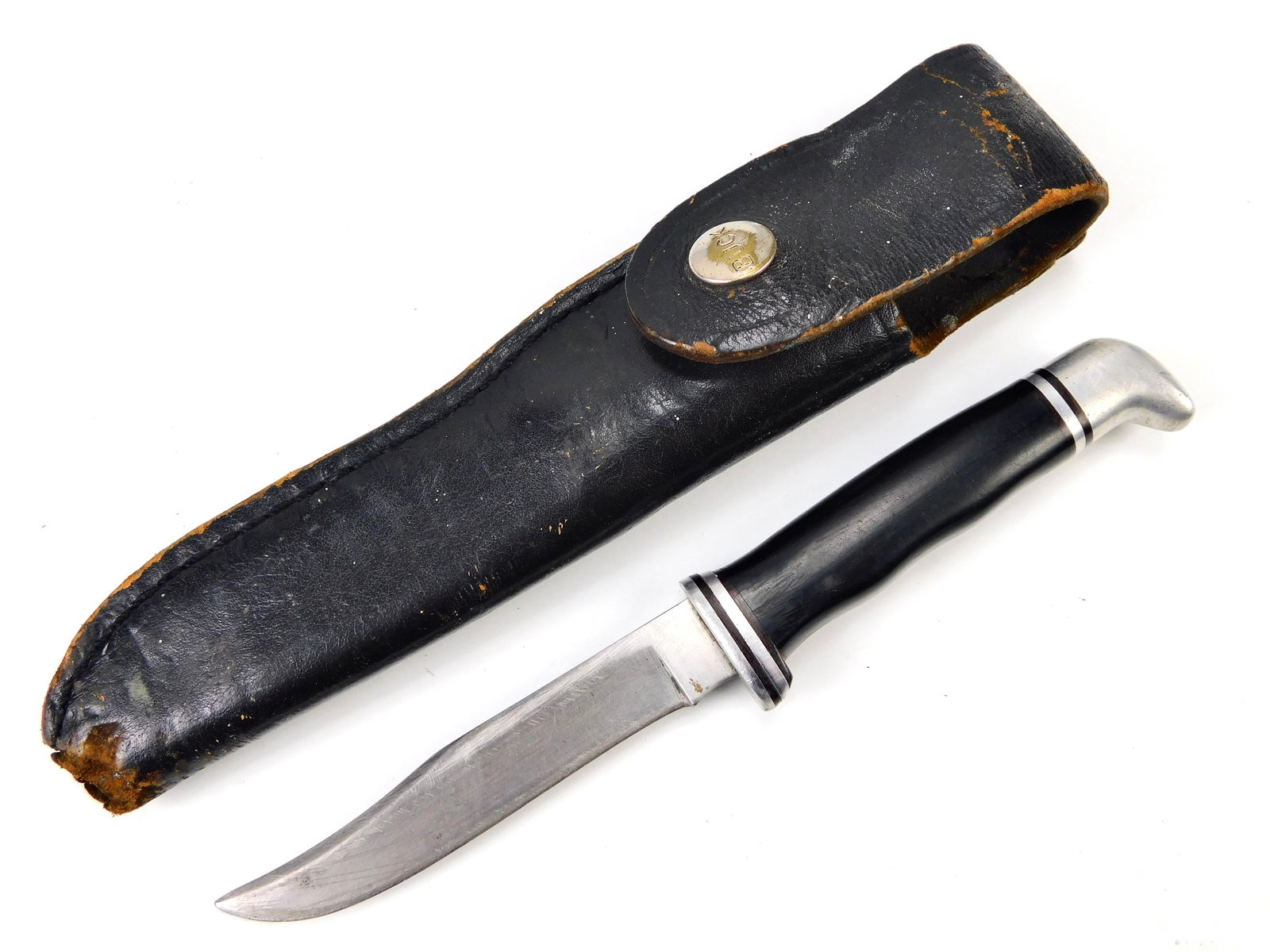 Vintage US Early Pre Dated Buck 102 Bowie Hunting Knife w/ Sheath: Vintage US Early Pre Dated Buck 102 Bowie Hunting Knife with Leather Sheath. 7 3/4" long with a 4" blade. The sheath has some damage, as pictured.