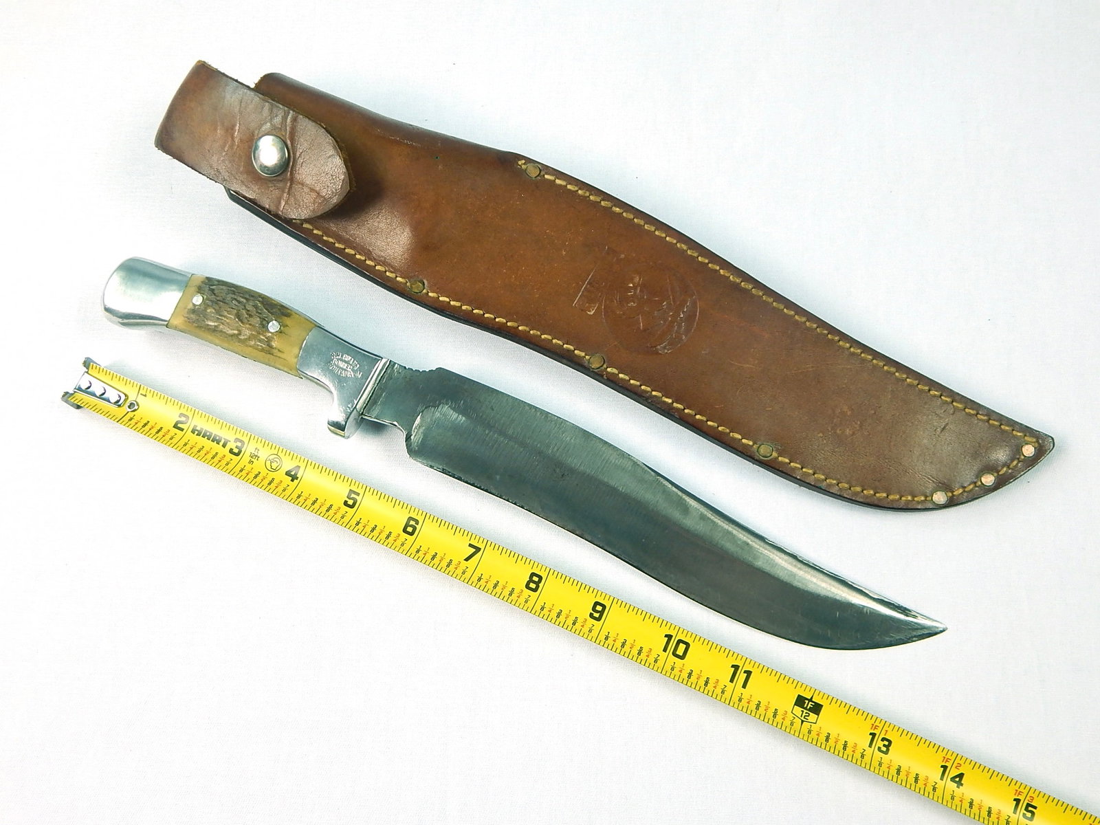 Vintage US Custom RUANA M Stamped 9" Blade Hunting Knife: Vintage US Custom Made RUANA "M" Stamped Large Hunting Knife with Leather Sheath. Knife is solid, no loose parts. Size: 13 1/2" total length, blade is 9".