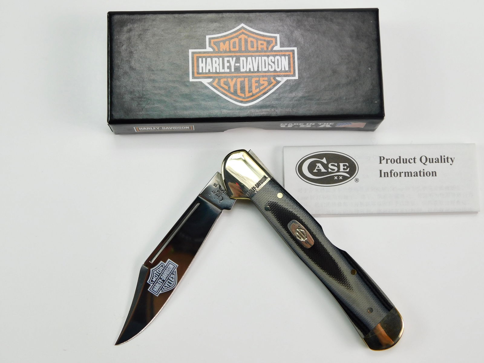 2014 Case XX Tested 101549L SS Copperlock Folding Knife: US 2014 Case XX Tested 101549L SS Copperlock Black Silver Harley Davidson Folding Pocket Knife with Box. New old stock. Measurements are pictured.