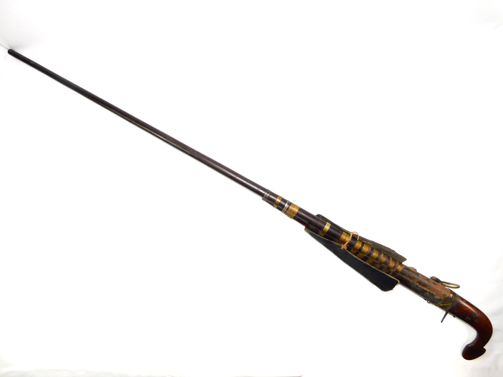 Antique Middle East or African Flintlock Rifle: Antique Middle Eastern or African Flintlock Rifle. Action in working conditions. The barrel has some kind of wood block inside. There is no international shipping on this item