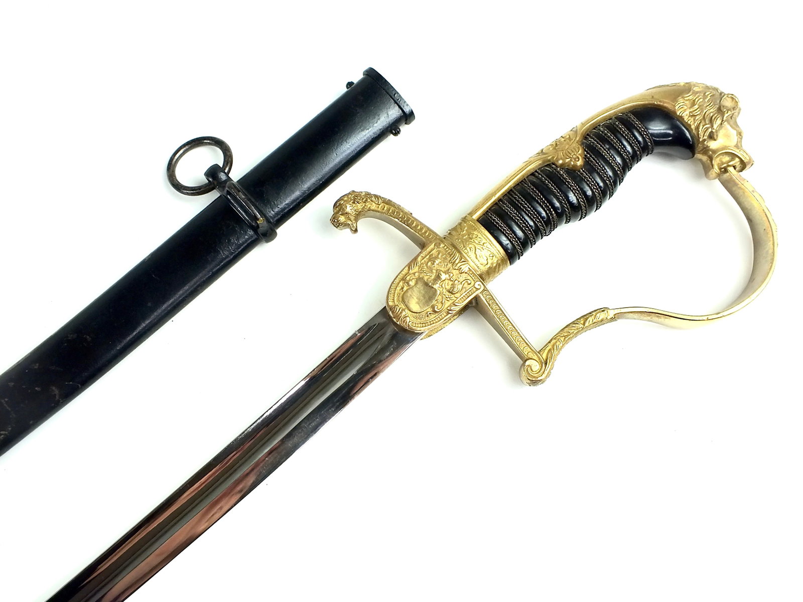 Antique German WW1 WKC Lion Head Artillery Sword: German WW1 WKC Lion Head Artillery Officer's Sword with Scabbard. Very good condition. Solid, no loose parts. 37 1/8" total length. The blade is 31 3/4"