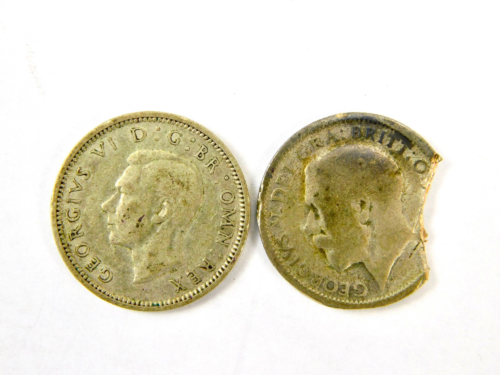 Set of 2 Great Britain England 1925 1942 Coin Sixpence: Set of 2 Great Britain Coins. One is damaged.