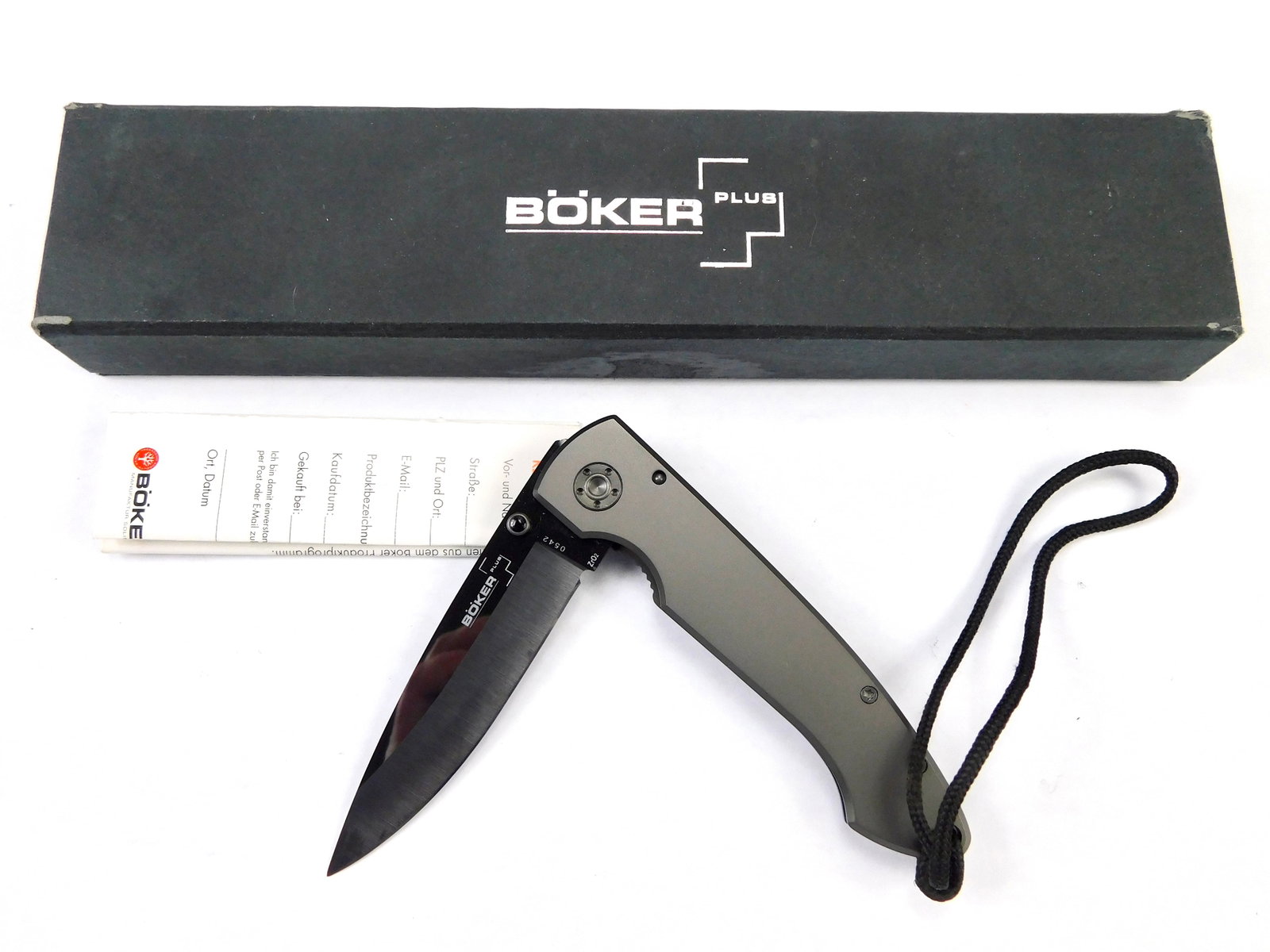 Boker Plus Model 0542 Tactical Folding Pocket Knife: Boker Plus Model 0542 Tactical Folding Pocket Knife with Box. Measurements are pictured. The blade doesn't snap when closing, no wobble.