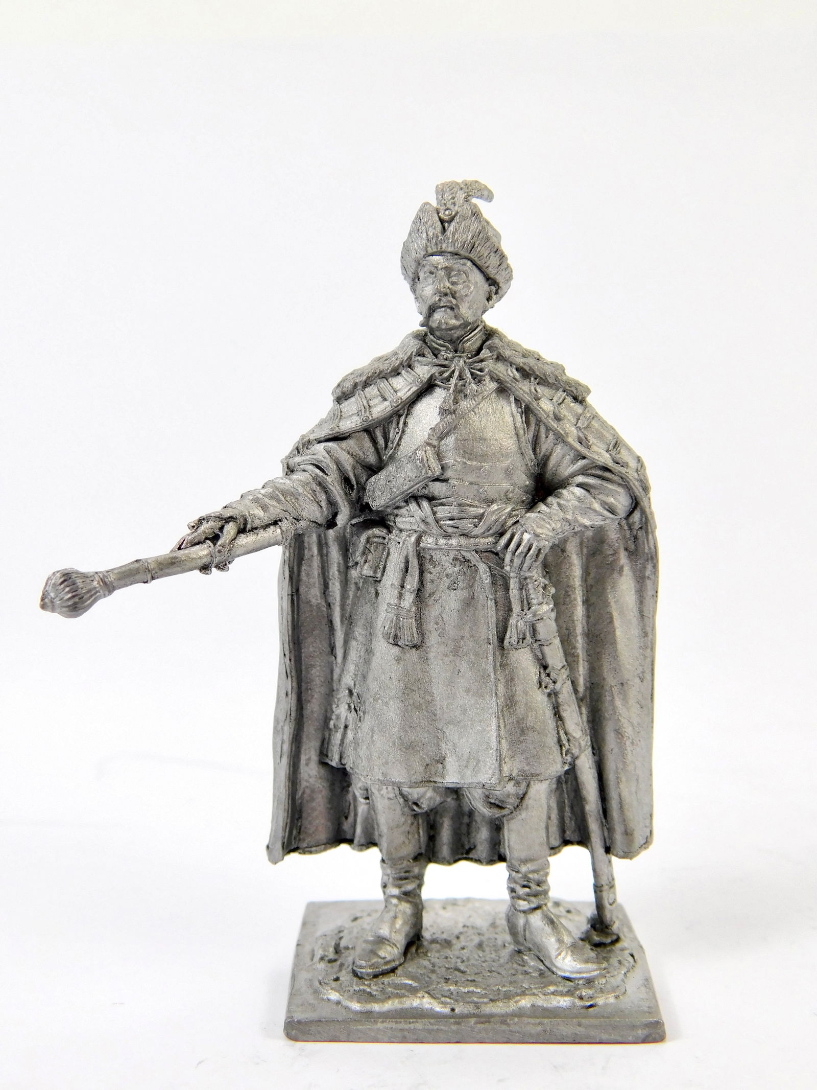 1970 European EK Castings Unpainted Tin Toy Soldier 17C Cossack Colonel Ukraine Mini Figurine: Vintage 1970s European EK Castings Unpainted 1:32 Scale Tin Toy Soldier Cossack Colonel, Ukraine, 17th century, marked on the top and bottom.