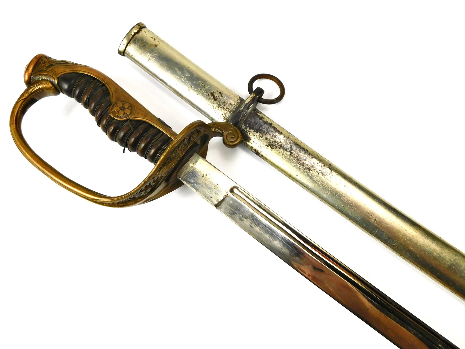Japanese Japan WW2 Officer's Dress Sword Family Mon Katana: Japanese WW2 Officer's Dress Sword with Family Mon with Scabbard. The hilt has a bit of movement. 34" total length. The blade is 29". No international shipping for this item. LiveAuctioneers is curren