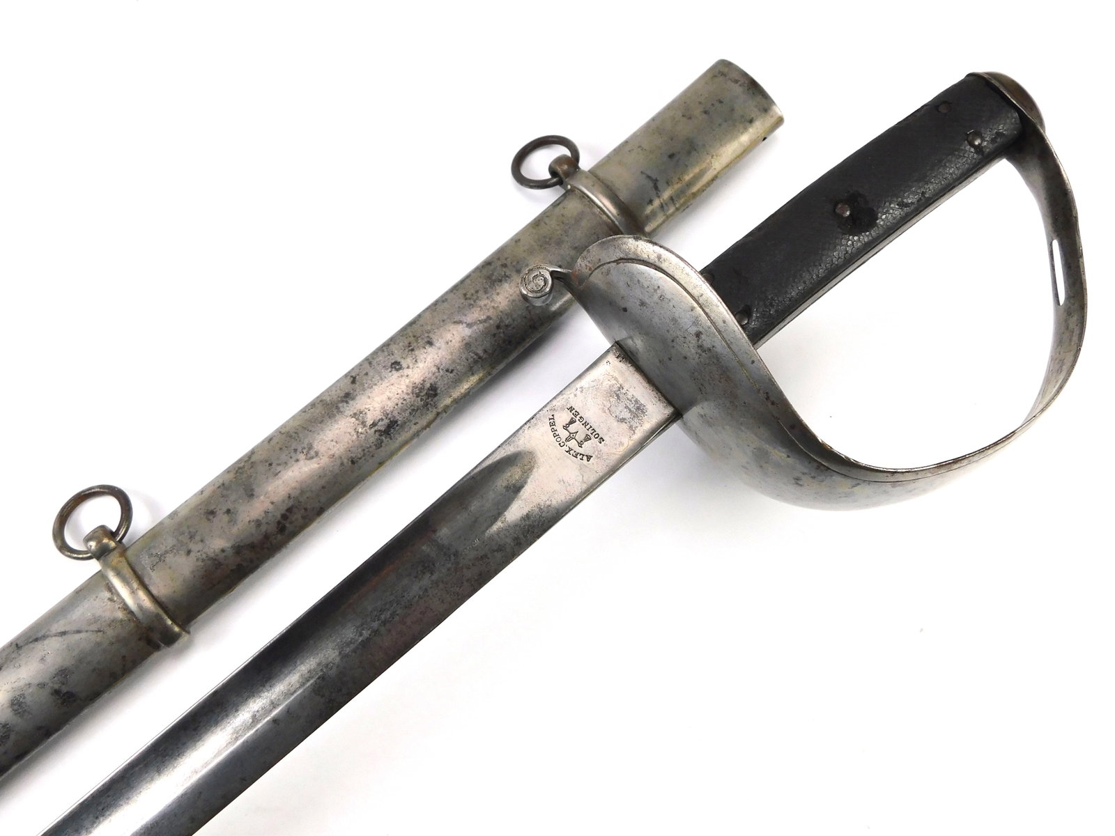 Antique Brazilian Brazil German Alex Coppel Made WW1 Cavalry Sword: Brazilian German-made WW1 Cavalry Sword with Scabbard. Solid, no loose parts. The blade is a bit bent closer to the point. 41" total length. The blade is 35 1/4". LiveAuctioneers is currently displayi