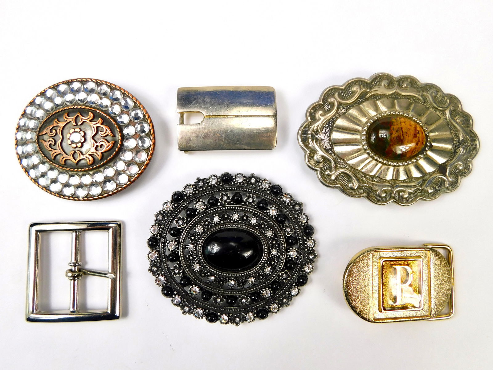 Lot of 6 Vintage Belt Buckle Jeweled Metal US Italy " P " Lee: Lot of 6 Vintage Belt Buckles. LiveAuctioneers is currently displaying only their own expensive shipping options. However, we offer reasonably priced in-house shipping on most items. Please contact us