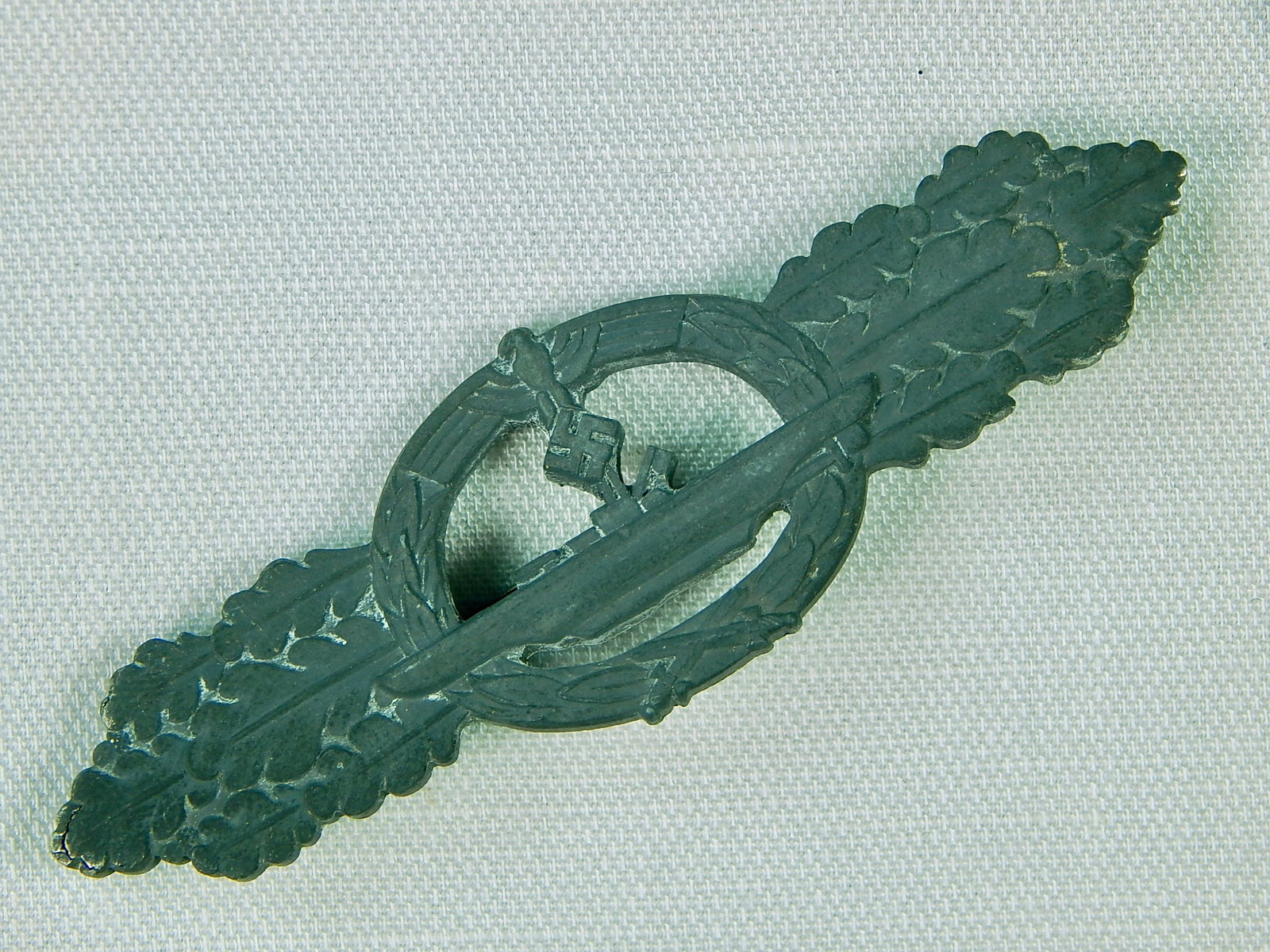 German Nazi WW2 U Boat Close Combat Silver Badge Pin: German WW2 Kriegsmarine U Boat Close Combat Silver Grade Clasp Badge. A little bit of silver wash is left on the edges. LiveAuctioneers is currently displaying only it's own expensive shipping options
